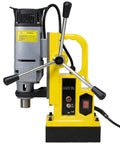 Workhorse Magnetic Drill Press Equipped With MT3 Spindle Taper And 13 Piece Annular Cutter Set For Knocking Out Clean Holes In Thick Metal Panels Up To Two Inches Deep 1350 Watt Motor Built Damn Tough For The Daily Grind, yellow portable drill side view.