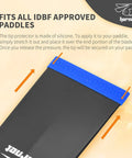 Paddle Tip Protector Silicone Guard For IDBF Approved Paddles, Easy Stretch-On Shield Between Races And For Transport in blue, shown installed on a paddle tip.