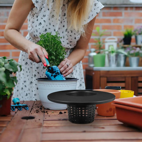 Woman gardening with Durable Hydroponic Mesh Net Pots Buckets With High Drainage For Healthy Roots And Easy Garden Setup