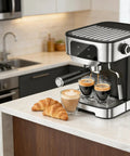 Sleek White Espresso Machine And Compact Cold Brew Coffee Maker Includes Barista Kit Dishwasher Safe Parts For No Sweat Setup Smooth Daily Java Ready To Go with coffee and croissants.