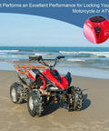 ATV with 2 Pin Universal Motorcycle Ignition Starter Switch For ATVs And Dirt Bikes on beach, focus on ignition detail