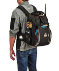 Person wearing Arsenal 5843 Tool Backpack With Dual Compartments For Pros, Heavy Duty 1200D Ballistic Polyester, side view