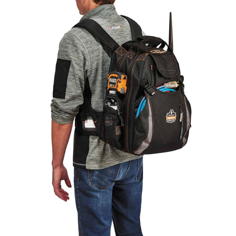Person wearing Arsenal 5843 Tool Backpack With Dual Compartments For Pros, Heavy Duty 1200D Ballistic Polyester, side view