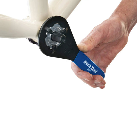 Using Bottom Bracket Wrench For Sealed Cartridges 44Mm Major Diameter And 38Mm Minor Diameter on bike, blue vinyl handle visible