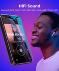 Man enjoying music with 72GB WiFi MP3 Player With Bluetooth 4.0 Inch Full Touch Screen MP4 Player With Speaker, purple background.