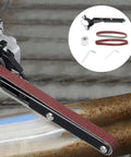 Heavy Duty Angle Grinder Belt Sander Adapter Built Tough With Wear Resistant Alloy mounted on a steel pipe for sanding.