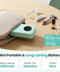 No Sweat Bluetooth Mini Label Maker With Compact Thermal Printer showing portable design, mint color, and accessories on wood table.