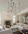 Sleek 12 Light Alabaster Pendant Lamp With Cylinder Shade And Killer Led Glow For Modern Dining Rooms overhead view in a stylish living room.