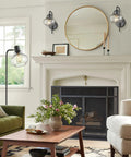 Rustic Wall Sconces Set Of 2 With Hand Blown Bubble Glass Shades on a white wall above a fireplace, modern farmhouse decor style.