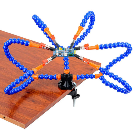Six Flexible Arm Helping Hands Soldering Station With Silicon Clip Tips clamped to table demonstrating use for electronics projects.