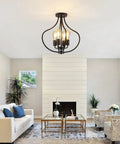 Go-To Four Light Farmhouse Semi Flush Ceiling Light In Black illuminating stylish living room with modern decor.