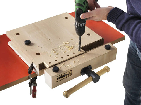 Heavy Duty Portable Woodworking Vise Offering Ridiculous Grip and Chunky MDF Top Slick Design in action, drilling into wood with tools.