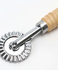 Pizza cutter wheel with wooden handle; zinc alloy fluted blade for pastries and pasta