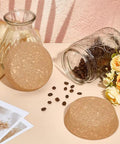 Two Pack Large Cork Stoppers For Bottles And Jars shown with glass jar and scattered coffee beans, floral decor in background.
