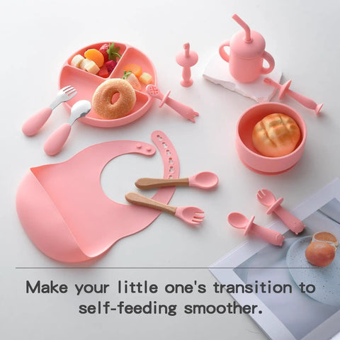 Silicone Baby Feeding Set 13Pc Kit With Suction Bowl Plate Spoons Forks Bib Cup Toothbrush LED Weaning Supplies For 6 Months Plus Pink Must Have Kid Friendly Mess Free displayed on white background.
