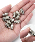 Hand holding 20 Piece M10 Straight Hydraulic Grease Fitting Kit With Zerk Fittings And Nipple Nozzles, corrosion resistant iron