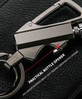 3 In 1 Infinity Lighter Keychain Permanent Match Lighter With Multitool Bottle Opener For Outdoor Survival Sleek Black And Gold Design Durable Key Ring Lighter For Camping And Everyday Carry on black leather background