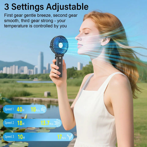 10400mAh Portable Handheld Fan With All Day Battery Life cooling a woman outdoors, showcasing adjustable 3-speed settings.