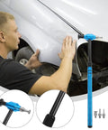 Pro Grade Multi Head Paintless Dent Removal Hammer Kit being used on a car panel for smooth finish repairs with alloy tips.