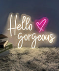 White 'Hello Gorgeous' neon sign with pink heart on gray wall, Pink LED Neon Sign Heart Shape Wall Light For Bedroom Wedding Party Bar And Christmas Decor 23.6 Inch Bright Yet Soft Glow Neon Light That Delivers Cozy Vibe And Fun Gift Idea