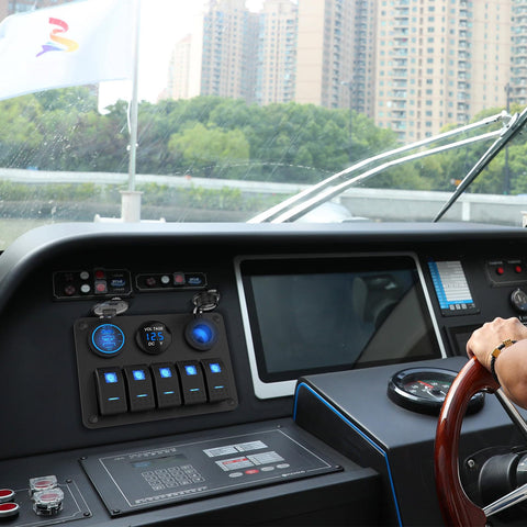 Five Gang Aluminum Marine Switch Panel with Three USB Ports and Blue LED Voltmeter on boat dashboard