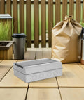Rugged Weatherproof Outdoor Electrical Junction Box With Breaker Panel Cover on wooden deck with outdoor setting.