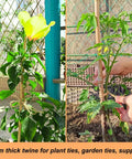 Jute Twine 165 Feet 4mm Thick Natural Rope used for plant support and garden ties, shown around plants for stability.