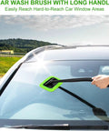 Inside Windshield Cleaning Tool With 22 Inch Detachable Handle used on car windshield with green microfiber pad outdoors