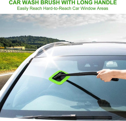 Inside Windshield Cleaning Tool With 22 Inch Detachable Handle used on car windshield with green microfiber pad outdoors