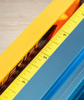 Close-up of Pro Grade Deluxe Router Table Fence Kit scale, showing measurement marks on the yellow ruler. 24x3-3/8 inches.