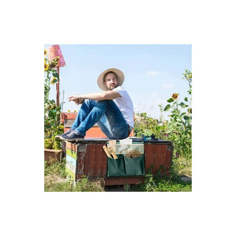 Man sitting beside Foldable Garden Kneeler With Tool Pouch And Multiple Pockets, Portable Kneeling Stool Bench For Gardening outdoors.