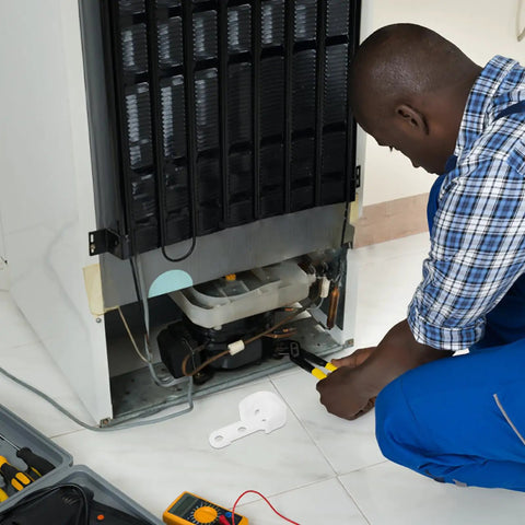 Man working on appliance with Premium White Refrigerator Door Stopper Replaces Latch Hook And Hinge Catch Clip for installation.