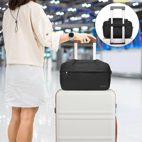 Underseat Carry On Duffle Bag 20L For Plane Travel, Gym, And Weekend Getaway shown atop luggage at airport