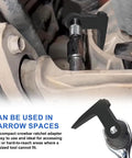 Ninety Degree Bend Pry Bar Wrench Adapter for Three Eighths Inch Drive in use for tight space automotive repair.