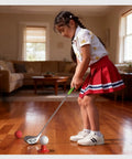 Child playing indoors with Kids Golf Set For Ages 3 To 8 Adjustable Indoor Outdoor Complete Kit With 3 Clubs 2 Holes And Flags 2 Tees 6 Balls