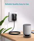 Do It All 24W AC To DC Power Adapter Kit plugged into wall near speaker on table