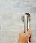 Hand holding 36 Inch Stainless Steel Handicap Grab Bar For Bathtub And Shower With Peened Grip Texture Concealed Screws