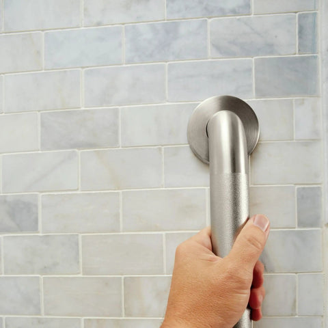 Hand holding 36 Inch Stainless Steel Handicap Grab Bar For Bathtub And Shower With Peened Grip Texture Concealed Screws