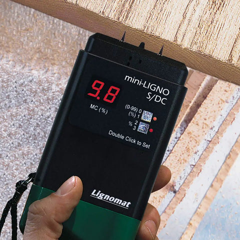 S4-P And Mini-Ligno SD/C Moisture Meter And Mold Detector Kit displaying 9.8% reading on wood surface