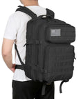Person wearing 45L Military Tactical Backpack With MOLLE System For Bug Out Ready Black Rucksack Army Assault Pack For Hiking And Trekking Durable Rucksack With Large Multi Layer Interior Storage