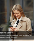 Woman using phone to control lights with Matter Smart Light Switch With Voice Control For Siri Alexa And Google Home Two Pack