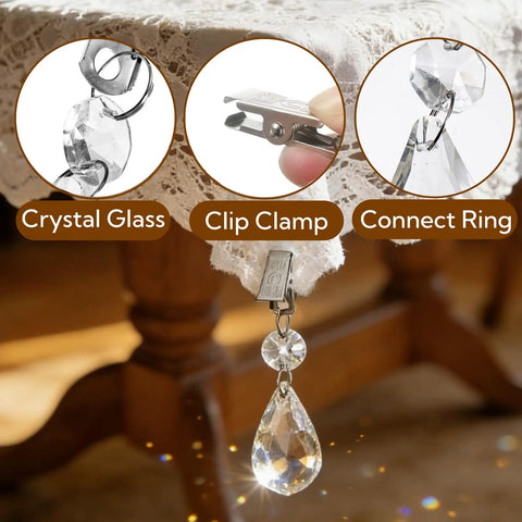 16 Pack Tablecloth Weights With Crystal Teardrop Pendants And Metal Clip Clamps For Glass Table Cover Hangers Perfect For Outdoor Picnics Family Dinners Parties And Elegant Decor, close-up view of crystal and clip clamp on lace tablecloth with background of wooden table legs.