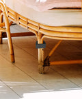 Wicker Rattan Furniture Connector Clips for Sectional Sofas securely attaching to rattan chair leg for stability on patio