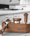 Wooden Espresso Tamper Holder Station With 3 Slots For Tampers And Portafilter on countertop, dark walnut finish, fits 51-54mm