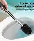 Compact Toilet Brush With Stainless Steel Handle And Hidden Base, shown cleaning under rim in toilet bowl