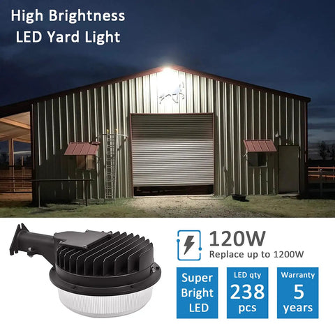 Powerful 120W LED Barn Light With Dusk To Dawn Photocell illuminating a large metal barn at night, 18000 lumens, 5000K daylight