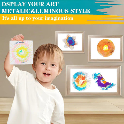 Child holding artwork with Spin Art Kit For Kids With Thick Paint Spinner Machine And Splatter Guard, framed art in background