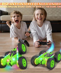 Children playing with remote control car with upgraded strip lights and bright headlights, showing 360 flips on hardwood floor.