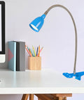 Olivia Dimmable Clamp Desk Lamp With Adjustable Color Temperature From Warm White To Cool White Easy Tap Power Button shown on desk.