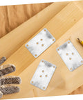 25 Pack Thick Iron Table Leg Plates Heavy Duty Furniture Feet Connectors For Wobbly Couches And Dining Tables Easy DIY Installation on wood surface.